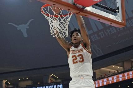 Dec 9, 2023; Austin, Texas, USA; Texas Longhorns forward Dillon Mitchell (23) dunks during the first half against the Houston Christian Huskies at Moody Center. Mandatory Credit: Scott Wachter-USA TODAY Sports