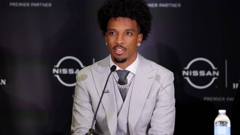 Dec 9, 2023; New York, New York, USA; LSU Tigers quarterback Jayden Daniels speaks to the media during a press conference in the Astor ballroom at the New York Marriott Marquis before the presentation of the Heisman trophy. Mandatory Credit: Brad Penner-USA TODAY Sports