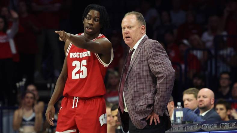 Dec 9, 2023; Tucson, Arizona, USA; Wisconsin Badgers guard John Blackwell (25) talks to Wisconsin Badgers head coach Greg Gard during the second half at McKale Center. Mandatory Credit: Zachary BonDurant-USA TODAY Sports