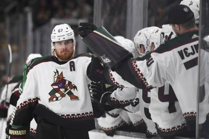 Dec 9, 2023; Boston, Massachusetts, USA;  Arizona Coyotes left wing Lawson Crouse (67) celebrates with teammates after scoring a goal against the Boston Bruins during the third period at TD Garden. Mandatory Credit: Bob DeChiara-USA TODAY Sports