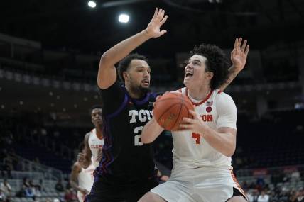 Dec 9, 2023; Toronto, Ontario, CAN; Clemson Tigers forward Ian Schieffelin (4) goes to shoot as TCU Horned Frogs forward JaKobe Coles (21) defends during the second half at Coca-Cola Coliseum. Mandatory Credit: John E. Sokolowski-USA TODAY Sports