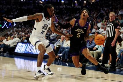 Dec 9, 2023; Norfolk, Virginia, USA; James Madison Dukes guard Terrence Edwards (5) drives to the basket against Old Dominion Monarchs guard Tyrone Williams (10) at Chartway Arena at the Ted Constant Convocation Center. Mandatory Credit: Peter Casey-USA TODAY Sports