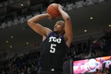 Dec 9, 2023; Toronto, Ontario, CAN; TCU Horned Frogs forward Chuck O'Bannon Jr. (5) goes to shoot a basket against Clemson Tigers during the first half at Coca-Cola Coliseum. Mandatory Credit: John E. Sokolowski-USA TODAY Sports