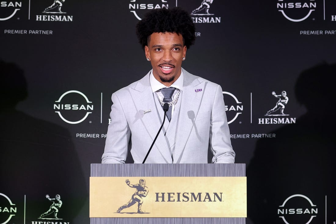 Dec 9, 2023; New York, New York, USA; LSU Tigers quarterback Jayden Daniels speaks to the media during a press conference in the Astor ballroom at the New York Marriott Marquis after winning the Heisman trophy. Mandatory Credit: Brad Penner-USA TODAY Sports