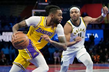 Dec 9, 2023; Las Vegas, Nevada, USA; Los Angeles Lakers guard D'Angelo Russell (1) drives against Indiana Pacers forward Bruce Brown (11) in the third quarter of the in season tournament championship final at T-Mobile Arena. Mandatory Credit: Kyle Terada-USA TODAY Sports