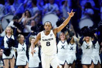 Dec 9, 2023; Cincinnati, Ohio, USA; Xavier Musketeers guard Quincy Olivari (8) reacts after a made three-point basket in the second half against the Cincinnati Bearcats at Cintas Center. Mandatory Credit: Albert Cesare/The Enquirer-USA TODAY Sports