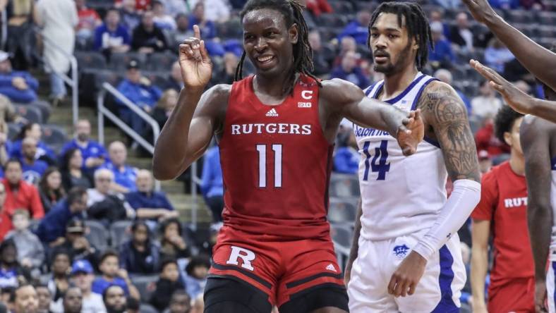 Dec 9, 2023; Newark, New Jersey, USA; Rutgers Scarlet Knights center Clifford Omoruyi (11) reacts after blocking shot in the second half against the Seton Hall Pirates at Prudential Center. Mandatory Credit: Wendell Cruz-USA TODAY Sports