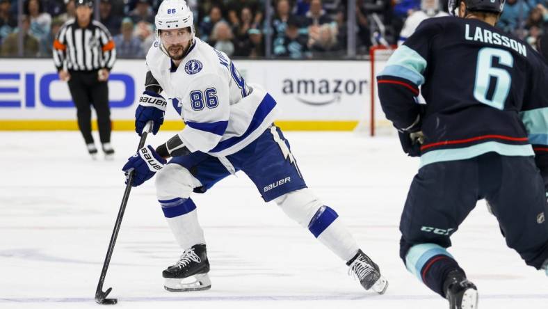 Dec 9, 2023; Seattle, Washington, USA; Tampa Bay Lightning right wing Nikita Kucherov (86) skates with the puck against the Seattle Kraken during the first period at Climate Pledge Arena. Mandatory Credit: Joe Nicholson-USA TODAY Sports