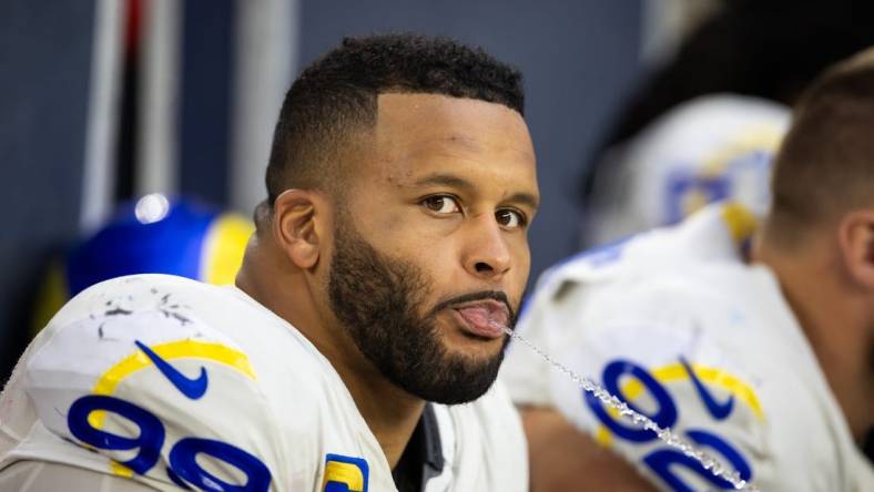 Nov 26, 2023; Glendale, Arizona, USA; Los Angeles Rams defensive tackle Aaron Donald (99) spits water out of his mouth against the Arizona Cardinals at State Farm Stadium. Mandatory Credit: Mark J. Rebilas-USA TODAY Sports