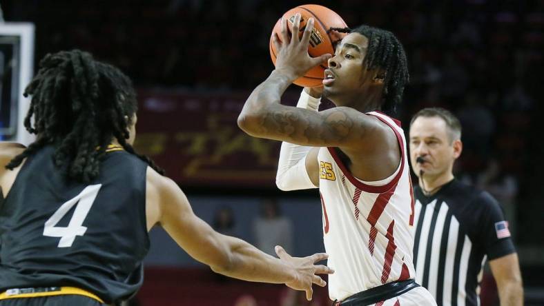 Iowa State Cyclones guard Keshon Gilbert (10) looks for pass the ball around Prairie View A&M Panthers guard Charles Smith IV (4) during the first half of a NCAA college basketball at Hilton Coliseum on Sunday, Dec. 10, 2023, in Ames, Iowa.