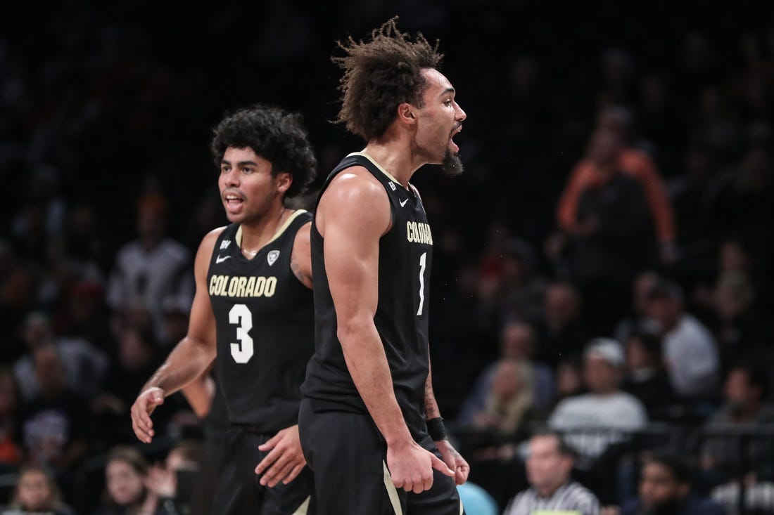 Dec 10, 2023; Brooklyn, New York, USA;  Colorado Buffaloes guard J'Vonne Hadley (1) celebrates after the Miami (Fl) Hurricanes call a timeout in the first half at Barclays Center. Mandatory Credit: Wendell Cruz-USA TODAY Sports