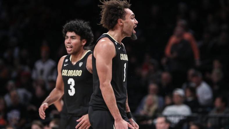 Dec 10, 2023; Brooklyn, New York, USA;  Colorado Buffaloes guard J'Vonne Hadley (1) celebrates after the Miami (Fl) Hurricanes call a timeout in the first half at Barclays Center. Mandatory Credit: Wendell Cruz-USA TODAY Sports