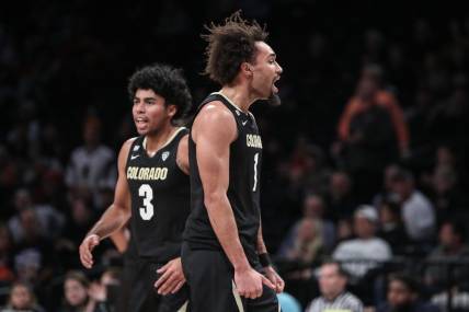 Dec 10, 2023; Brooklyn, New York, USA;  Colorado Buffaloes guard J'Vonne Hadley (1) celebrates after the Miami (Fl) Hurricanes call a timeout in the first half at Barclays Center. Mandatory Credit: Wendell Cruz-USA TODAY Sports