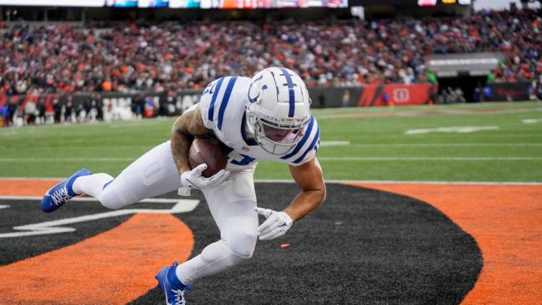 Indianapolis Colts wide receiver Michael Pittman Jr. (11) brings a pass down in the end zone for a two-point conversion Sunday, Dec. 10, 2023, during a game against the Cincinnati Bengals at Paycor Stadium in Cincinnati.