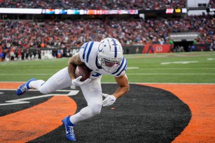 Indianapolis Colts wide receiver Michael Pittman Jr. (11) brings a pass down in the end zone for a two-point conversion Sunday, Dec. 10, 2023, during a game against the Cincinnati Bengals at Paycor Stadium in Cincinnati.