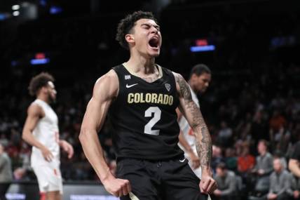 Dec 10, 2023; Brooklyn, New York, USA; Colorado Buffaloes guard KJ Simpson (2) celebrates after scoring in the second half against the Miami (Fl) Hurricanes at Barclays Center. Mandatory Credit: Wendell Cruz-USA TODAY Sports