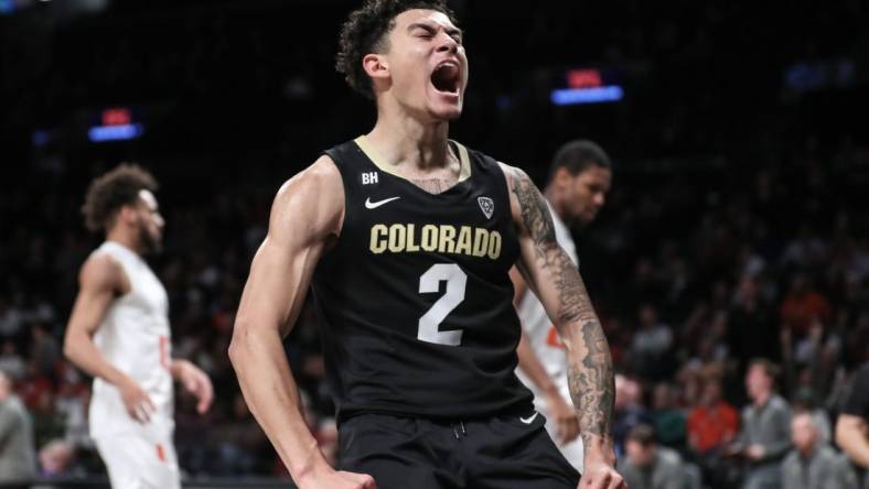 Dec 10, 2023; Brooklyn, New York, USA; Colorado Buffaloes guard KJ Simpson (2) celebrates after scoring in the second half against the Miami (Fl) Hurricanes at Barclays Center. Mandatory Credit: Wendell Cruz-USA TODAY Sports