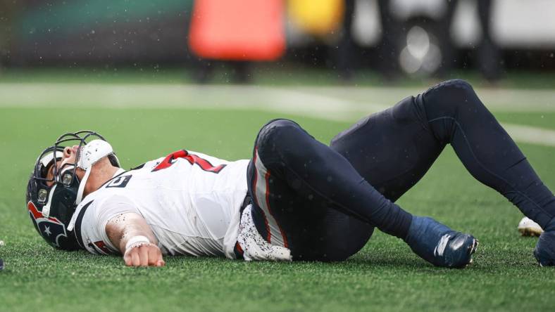 Dec 10, 2023; East Rutherford, New Jersey, USA; Houston Texans quarterback C.J. Stroud (7) on the field after an apparent injury during the second half against the New York Jets at MetLife Stadium. Mandatory Credit: Vincent Carchietta-USA TODAY Sports