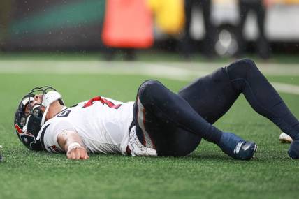 Dec 10, 2023; East Rutherford, New Jersey, USA; Houston Texans quarterback C.J. Stroud (7) on the field after an apparent injury during the second half against the New York Jets at MetLife Stadium. Mandatory Credit: Vincent Carchietta-USA TODAY Sports