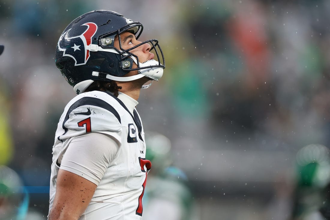 Dec 10, 2023; East Rutherford, New Jersey, USA; Houston Texans quarterback C.J. Stroud (7) walks off the field after an apparent injury during the second half against the New York Jets at MetLife Stadium. Mandatory Credit: Vincent Carchietta-USA TODAY Sports