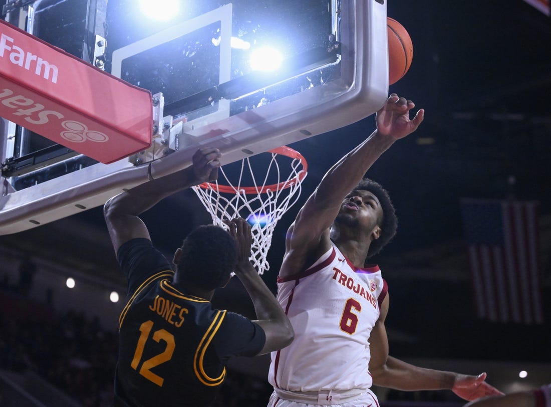 Dec 10, 2023; Los Angeles, California, USA; USC Trojans guard Bronny James (6) blocks a shot by Long Beach State 49ers guard Jadon Jones (12) in the first half at Galen Center. It was James  first game of the season since suffering a near fatal heat attack. Mandatory Credit: Robert Hanashiro-USA TODAY Sports