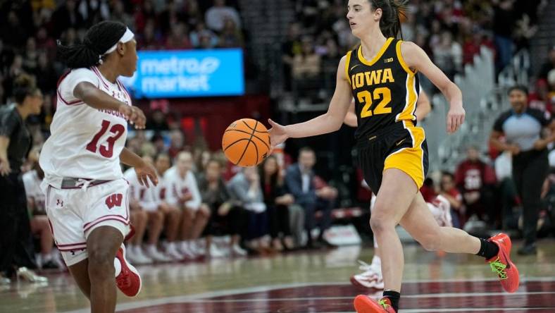 Dec 10, 2023; Madison, Wis. USA; Iowa guard Caitlin Clark (22) is on a fast break against Wisconsin during the second half  at the Kohl Center. Mandatory Credit   Mark Hoffman/USA TODAY Sports Network via Milwaukee Journal Sentinel