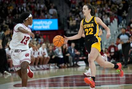 Dec 10, 2023; Madison, Wis. USA; Iowa guard Caitlin Clark (22) is on a fast break against Wisconsin during the second half  at the Kohl Center. Mandatory Credit   Mark Hoffman/USA TODAY Sports Network via Milwaukee Journal Sentinel