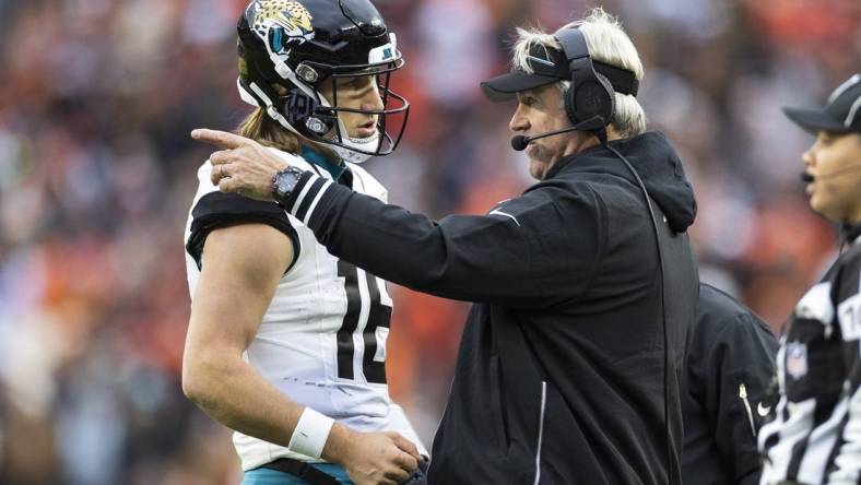 Dec 10, 2023; Cleveland, Ohio, USA; Jacksonville Jaguars head coach Doug Pederson talks with quarterback Trevor Lawrence (16) during the third quarter against the Cleveland Browns at Cleveland Browns Stadium. Mandatory Credit: Scott Galvin-USA TODAY Sports