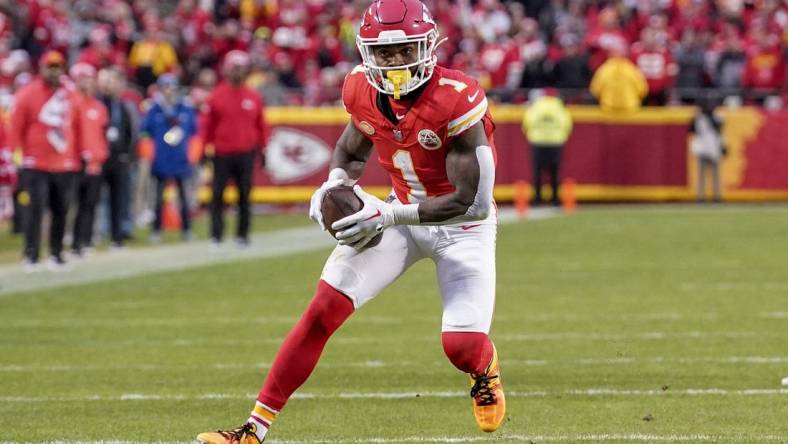 Dec 10, 2023; Kansas City, Missouri, USA; Kansas City Chiefs running back Jerick McKinnon (1) runs the ball against the Buffalo Bills during the first half at GEHA Field at Arrowhead Stadium. Mandatory Credit: Denny Medley-USA TODAY Sports