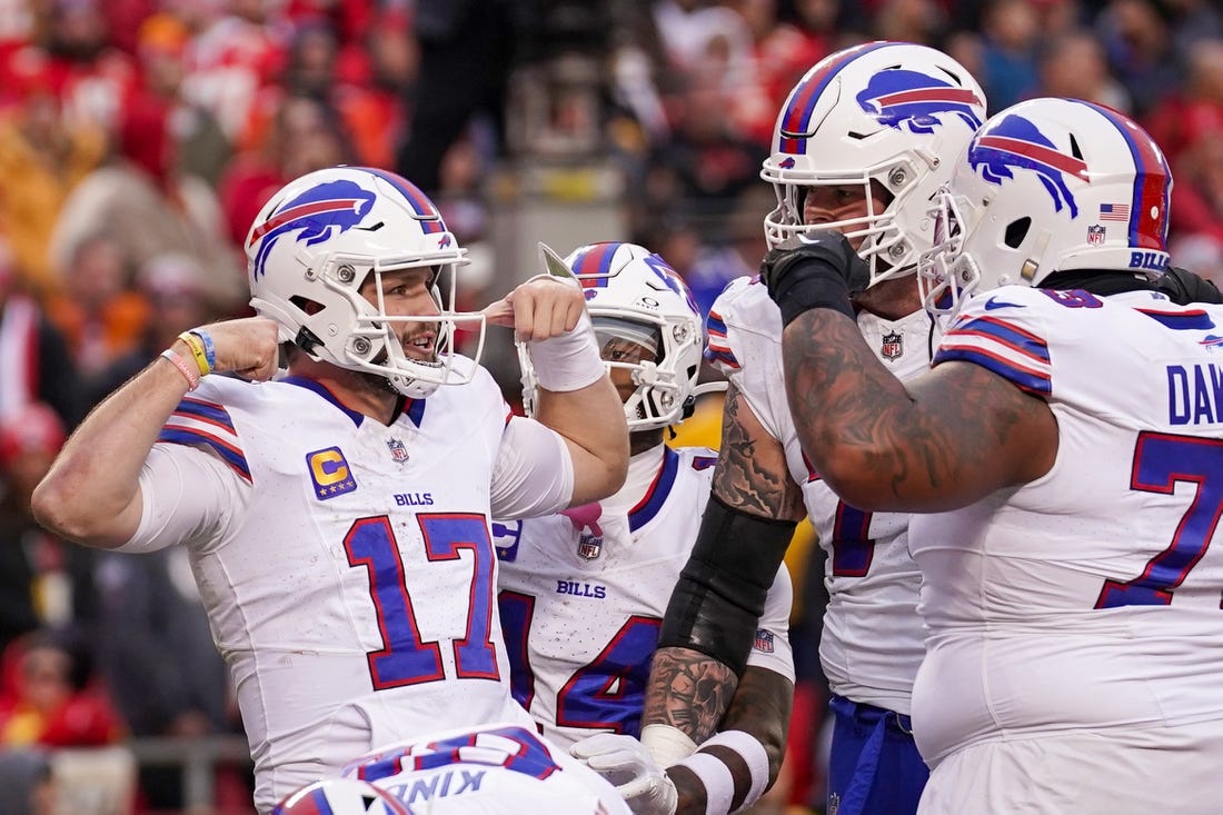 Dec 10, 2023; Kansas City, Missouri, USA; Buffalo Bills quarterback Josh Allen (17) celebrates with team mates after a score against the Kansas City Chiefs during the first half at GEHA Field at Arrowhead Stadium. Mandatory Credit: Denny Medley-USA TODAY Sports