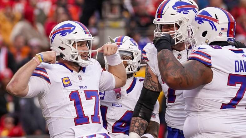 Dec 10, 2023; Kansas City, Missouri, USA; Buffalo Bills quarterback Josh Allen (17) celebrates with team mates after a score against the Kansas City Chiefs during the first half at GEHA Field at Arrowhead Stadium. Mandatory Credit: Denny Medley-USA TODAY Sports