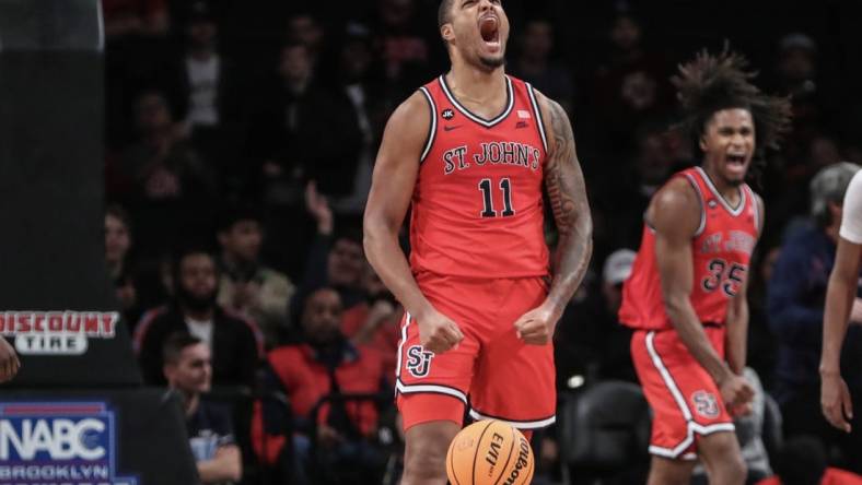 Dec 10, 2023; Brooklyn, New York, USA; St. John's Red Storm center Joel Soriano (11) celebrates after scoring in the second half against the Boston College Eagles at Barclays Center. Mandatory Credit: Wendell Cruz-USA TODAY Sports