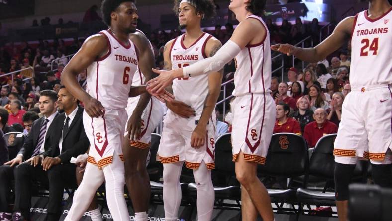 Dec 10, 2023; Los Angeles, California, USA; USC Trojans guard Bronny James (6) returns to the bench during the first half against the Long Beach State 49ers at Galen Center. Mandatory Credit: Robert Hanashiro-USA TODAY Sports