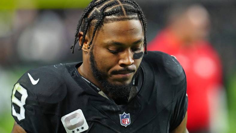 Dec 10, 2023; Paradise, Nevada, USA; Las Vegas Raiders running back Josh Jacobs (8) walks off the field after the Raiders were defeated by the Minnesota Vikings 3-0 at Allegiant Stadium. Mandatory Credit: Stephen R. Sylvanie-USA TODAY Sports