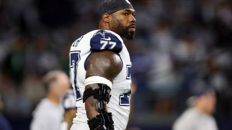 Dec 10, 2023; Arlington, Texas, USA; Dallas Cowboys offensive tackle Tyron Smith (77) on the field before the game against the Philadelphia Eagles at AT&T Stadium. Mandatory Credit: Tim Heitman-USA TODAY Sports