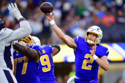Dec 10, 2023; Inglewood, California, USA; Los Angeles Chargers quarterback Easton Stick (2) throws against the Denver Broncos during the second half at SoFi Stadium. Mandatory Credit: Gary A. Vasquez-USA TODAY Sports