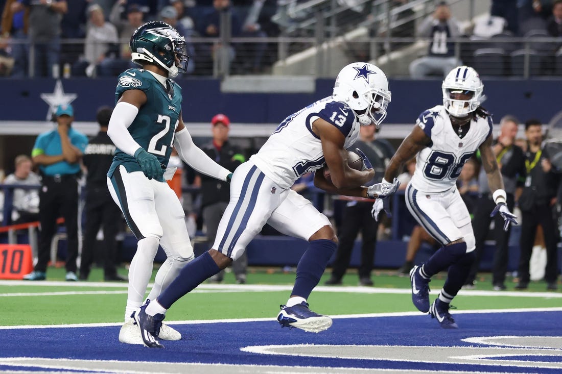 Dec 10, 2023; Arlington, Texas, USA; Dallas Cowboys wide receiver Michael Gallup (13) catches a touchdown pass against Philadelphia Eagles cornerback James Bradberry (24) in the second quarter at AT&T Stadium. Mandatory Credit: Tim Heitman-USA TODAY Sports