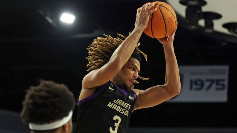 Dec 9, 2023; Norfolk, Virginia, USA; James Madison Dukes forward T.J. Bickerstaff (3) grabs a rebound against the Old Dominion Monarchs at Chartway Arena at the Ted Constant Convocation Center. Mandatory Credit: Peter Casey-USA TODAY Sports