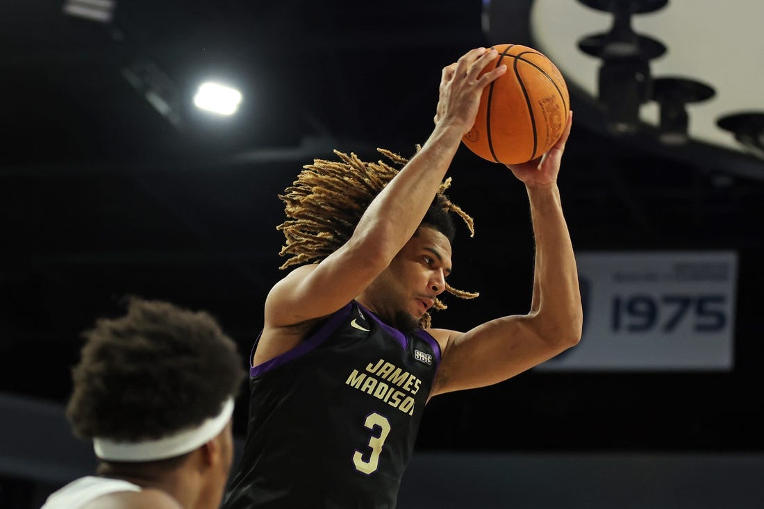 Dec 9, 2023; Norfolk, Virginia, USA; James Madison Dukes forward T.J. Bickerstaff (3) grabs a rebound against the Old Dominion Monarchs at Chartway Arena at the Ted Constant Convocation Center. Mandatory Credit: Peter Casey-USA TODAY Sports
