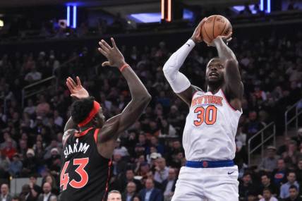 Dec 11, 2023; New York, New York, USA; New York Knicks forward Julius Randle (30) shoots the ball while being defended by Toronto Raptors forward Pascal Siakam (43) during the first quarter at Madison Square Garden. Mandatory Credit: John Jones-USA TODAY Sports