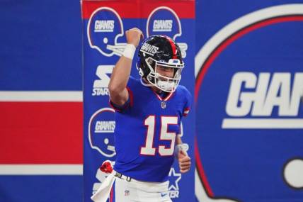 Dec 11, 2023; East Rutherford, New Jersey, USA; New York Giants quarterback Tommy DeVito (15) reacts before the game against the Green Bay Packers at MetLife Stadium. Mandatory Credit: Robert Deutsch-USA TODAY Sports