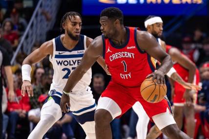 Dec 11, 2023; New Orleans, Louisiana, USA; New Orleans Pelicans forward Zion Williamson (1) dribbles against Minnesota Timberwolves forward Troy Brown Jr. (23) during the first half at the Smoothie King Center. Mandatory Credit: Stephen Lew-USA TODAY Sports