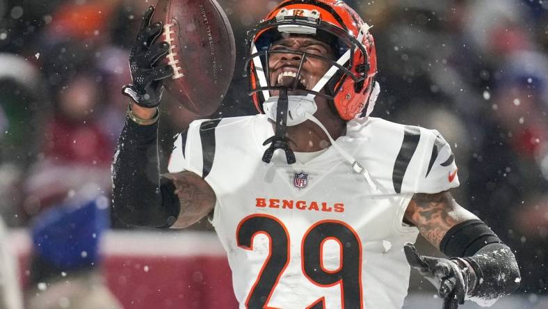 Cincinnati Bengals cornerback Cam Taylor-Britt (29) celebrates after intercepting a pass to seal a Bengals win in the fourth quarter of the NFL divisional playoff football game between the Cincinnati Bengals and the Buffalo Bills, Sunday, Jan. 22, 2023, at Highmark Stadium in Orchard Park, N.Y. The Bengals won 27-10 to advance to the AFC Championship game against the Kansas City Chiefs.