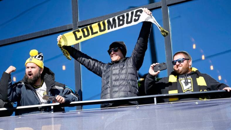 Dec 12, 2023; Columbus, OH, USA; Columbus Crew fans cheer as they watch a parade celebrating their 2023 MLS Cup victory at Lower.com Field.