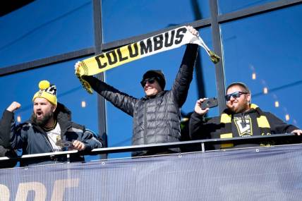 Dec 12, 2023; Columbus, OH, USA; Columbus Crew fans cheer as they watch a parade celebrating their 2023 MLS Cup victory at Lower.com Field.