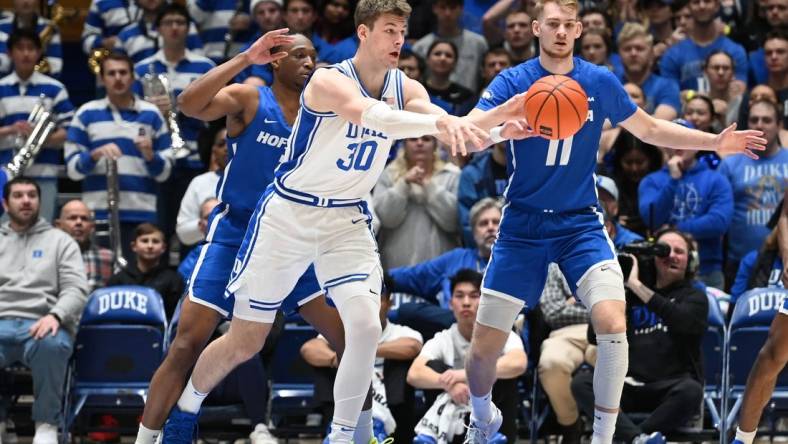 Dec 12, 2023; Durham, North Carolina, USA; Duke Blue Devils center Kyle Filipowski (30) throws a pass during the first half against the Hofstra Bison at Cameron Indoor Stadium. Mandatory Credit: Rob Kinnan-USA TODAY Sports