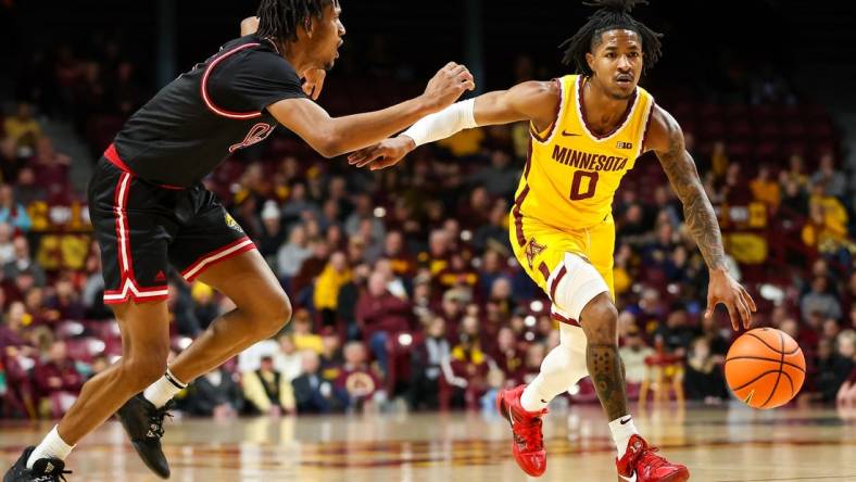 Dec 12, 2023; Minneapolis, Minnesota, USA; Minnesota Golden Gophers guard Elijah Hawkins (0) works around IUPUI Jaguars guard Kidtrell Blocker (8) during the first half at Williams Arena. Mandatory Credit: Matt Krohn-USA TODAY Sports