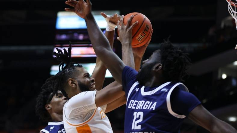 Dec 12, 2023; Knoxville, Tennessee, USA; Tennessee Volunteers forward Jonas Aidoo (0) goes to the basket against Georgia Southern Eagles guard Tyren Moore (12) at Food City Center at Thompson-Boling Arena. Mandatory Credit: Randy Sartin-USA TODAY Sports