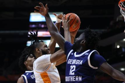 Dec 12, 2023; Knoxville, Tennessee, USA; Tennessee Volunteers forward Jonas Aidoo (0) goes to the basket against Georgia Southern Eagles guard Tyren Moore (12) at Food City Center at Thompson-Boling Arena. Mandatory Credit: Randy Sartin-USA TODAY Sports