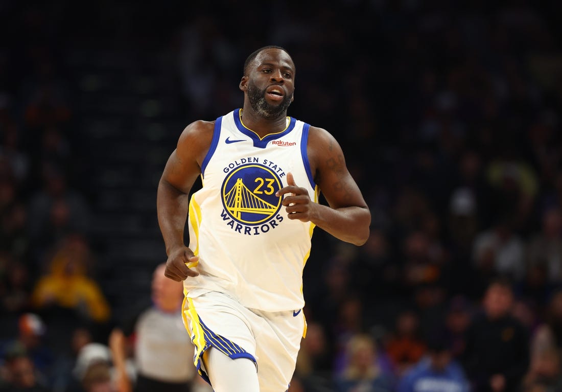 Dec 12, 2023; Phoenix, Arizona, USA; Golden State Warriors forward Draymond Green (23) against the Phoenix Suns at Footprint Center. Mandatory Credit: Mark J. Rebilas-USA TODAY Sports